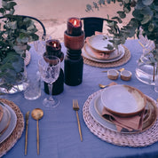 Rustic dinner plate in brown and blue handmade stoneware on outdoor table setting 