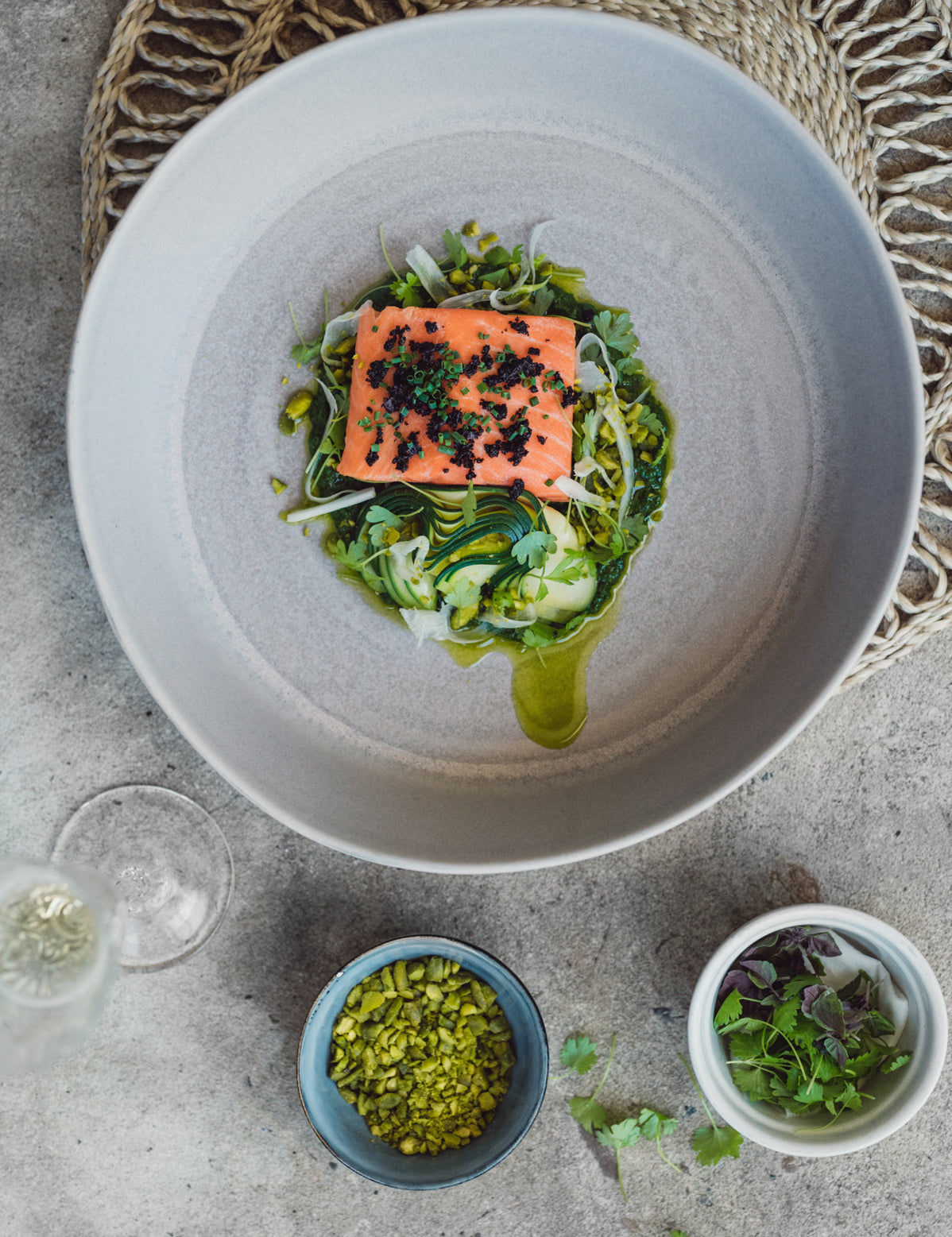 Handmade stoneware fruit bowl in a neutral mushroom grey plated up by Sydney chef Gerald Touchard with salmon and veggies